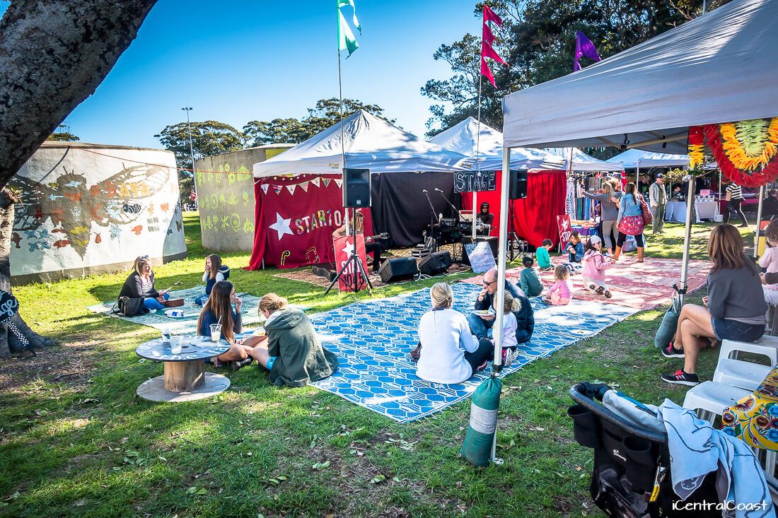 rugs laid out on the ground where you can sit, eat and listen to live music Markets