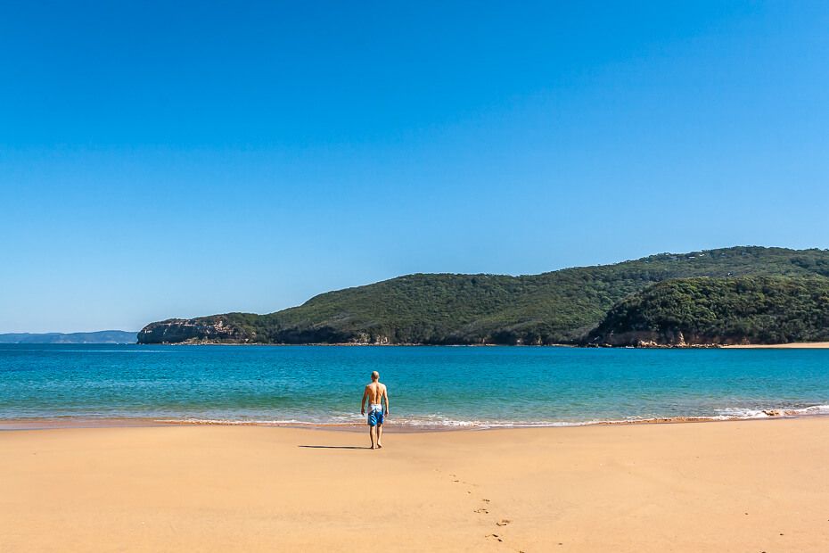 Man going for a swim at the beach